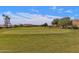 Scenic view of a golf course featuring rolling hills and desert landscaping with mountain views at 9241 S 50Th St, Phoenix, AZ 85044