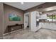 Bright kitchen featuring granite countertops, stainless steel appliances, and white cabinetry at 9241 S 50Th St, Phoenix, AZ 85044