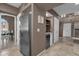 Kitchen with white cabinets, granite counters, stainless steel appliances, and a wine cooler at 9241 S 50Th St, Phoenix, AZ 85044