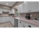 Bright kitchen featuring granite countertops, stainless steel appliances, and white cabinetry at 9241 S 50Th St, Phoenix, AZ 85044