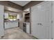 Kitchen with white cabinets, granite counters, and a built-in wine cooler at 9241 S 50Th St, Phoenix, AZ 85044
