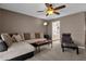 Cozy living room featuring comfortable seating, soft lighting, and an open doorway to the bathroom at 9241 S 50Th St, Phoenix, AZ 85044