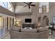 Bright living room with clerestory windows, neutral color palette, and view of staircase at 9241 S 50Th St, Phoenix, AZ 85044