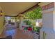 Covered patio has dining and grill, perfect for outdoor cooking and entertaining at 9241 S 50Th St, Phoenix, AZ 85044