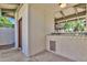 Pool house with tiled counter and serving area for convenient poolside entertaining at 9241 S 50Th St, Phoenix, AZ 85044