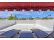 Rooftop patio with lounge chairs offering outdoor relaxation and potential views of the surrounding area at 9241 S 50Th St, Phoenix, AZ 85044
