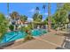 An inviting swimming pool area featuring comfortable lounge chairs and a scenic view of palm trees at 9241 S 50Th St, Phoenix, AZ 85044