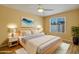 Cozy bedroom showcasing a bed with white linens, bedside tables, and a bright window at 9463 E Jenan Dr, Scottsdale, AZ 85260