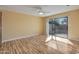 Bright and airy bedroom with sliding door access to the outside patio, along with an overhead ceiling fan at 9463 E Jenan Dr, Scottsdale, AZ 85260