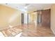 Spacious bedroom featuring hardwood floors and two closets including a sliding mirrored closet at 9463 E Jenan Dr, Scottsdale, AZ 85260