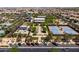 Beautiful aerial view of the community featuring pool, tennis courts, lawn, parking and other facilities at 9837 E Tiburon Ave, Mesa, AZ 85212