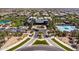 Aerial view of community clubhouse and pool area, showcasing landscaping and ample parking at 9837 E Tiburon Ave, Mesa, AZ 85212