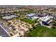 Beautiful aerial view of the community facilities including a pool, common green space, and playground at 9837 E Tiburon Ave, Mesa, AZ 85212