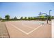 Outdoor community basketball court ready for a game, featuring nearby park and playground areas at 9837 E Tiburon Ave, Mesa, AZ 85212