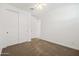Well lit bedroom featuring a ceiling fan, closet, and soft carpet floors at 9837 E Tiburon Ave, Mesa, AZ 85212