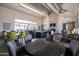 Inviting common area with ample seating, a fireplace, and a kitchen island for social gatherings at 9837 E Tiburon Ave, Mesa, AZ 85212