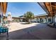 Serene courtyard with seating areas, lush landscaping, and mature shade trees at 9837 E Tiburon Ave, Mesa, AZ 85212