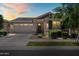 Charming single-story home featuring a two-car garage, covered entry, and landscaped front yard at 9837 E Tiburon Ave, Mesa, AZ 85212