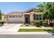 Charming single-story home featuring a two-car garage, covered entry, and landscaped front yard at 9837 E Tiburon Ave, Mesa, AZ 85212