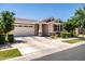 Charming single-story home featuring a two-car garage, covered entry, and landscaped front yard at 9837 E Tiburon Ave, Mesa, AZ 85212