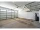 Spacious two-car garage with overhead storage and water filtration system at 9837 E Tiburon Ave, Mesa, AZ 85212