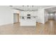 Bright kitchen features an island, white cabinets, and modern stainless steel appliances at 9837 E Tiburon Ave, Mesa, AZ 85212
