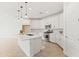 Bright kitchen with white cabinets, quartz countertops, and stainless steel appliances at 9837 E Tiburon Ave, Mesa, AZ 85212