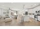 Bright, open-concept living space featuring modern furnishings and seamless flow to the kitchen at 9837 E Tiburon Ave, Mesa, AZ 85212