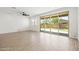 Living room features tile flooring, large sliding doors and access to backyard at 9837 E Tiburon Ave, Mesa, AZ 85212
