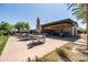 Outdoor kitchen and dining area with seating perfect for entertaining guests at 9837 E Tiburon Ave, Mesa, AZ 85212