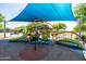 A colorful and shaded playground equipped with slides and climbing structures provides safe outdoor fun at 9837 E Tiburon Ave, Mesa, AZ 85212