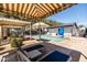 A spa pool with shaded lounge chairs and cabanas, offers ultimate relaxation and poolside amenities at 9837 E Tiburon Ave, Mesa, AZ 85212