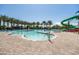 Large swimming pool with palm trees, water features, and lounge areas at 9837 E Tiburon Ave, Mesa, AZ 85212