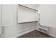 Spacious walk-in closet features wood shelves and carpeted flooring at 9837 E Tiburon Ave, Mesa, AZ 85212