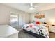 Comfortable bedroom with carpet, bright natural light, desert artwork and floral bedding at 9990 N Scottsdale Rd # 2042, Paradise Valley, AZ 85253