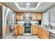 Efficient kitchen with stainless steel appliances, light wood cabinets, and a drop-in sink at 9990 N Scottsdale Rd # 2042, Paradise Valley, AZ 85253