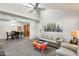 Inviting living room flowing into the dining area, featuring plush carpet and contemporary decor at 9990 N Scottsdale Rd # 2042, Paradise Valley, AZ 85253