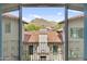 Balcony view showcasing the picturesque red-tile roofs and mountain scenery beyond at 10182 E Gilded Perch Dr, Scottsdale, AZ 85255