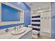Bright blue bathroom with classic tile accents, offering a clean and refreshing space at 10182 E Gilded Perch Dr, Scottsdale, AZ 85255