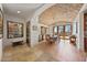 Dining room featuring brick ceiling, hardwood floors, and access to the outdoor patio at 10182 E Gilded Perch Dr, Scottsdale, AZ 85255