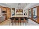 Gourmet kitchen with custom wood cabinetry, granite countertops, and a center island at 10182 E Gilded Perch Dr, Scottsdale, AZ 85255