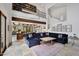 Open-concept living room with loft, offering comfortable seating and views of the game room below at 10182 E Gilded Perch Dr, Scottsdale, AZ 85255