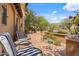 Inviting outdoor patio area with comfortable seating and views of manicured landscaping at 10182 E Gilded Perch Dr, Scottsdale, AZ 85255