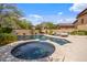 Sparkling pool with spa, sun loungers, and tiled accents offers a refreshing outdoor oasis in the backyard at 10182 E Gilded Perch Dr, Scottsdale, AZ 85255