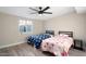 Comfortable bedroom with two beds and a ceiling fan at 10240 N 34Th Pl, Phoenix, AZ 85028