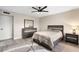 Cozy bedroom featuring modern furniture, ceiling fan, and neutral color scheme for a relaxing atmosphere at 10240 N 34Th Pl, Phoenix, AZ 85028