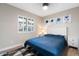 Charming bedroom with a soft rug, natural light, and stylish bedside tables at 10240 N 34Th Pl, Phoenix, AZ 85028