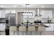 Modern kitchen featuring stainless steel appliances, sleek countertops, ample cabinet space, and a stylish island with seating at 10240 N 34Th Pl, Phoenix, AZ 85028
