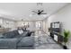 Spacious living room with a comfortable sectional sofa, pool table, and stylish decor for entertaining and relaxation at 10240 N 34Th Pl, Phoenix, AZ 85028