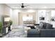 Inviting living room with an open layout, connecting the lounge area and kitchen to create a welcoming atmosphere at 10240 N 34Th Pl, Phoenix, AZ 85028